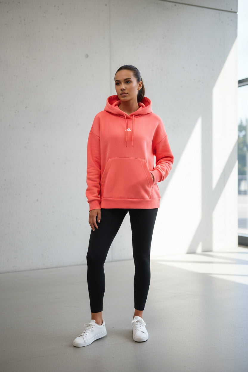 FELPA ADIDAS DONNA KE4380 colore salmone tasche a marsupio vista completa con pantalone abbinato 